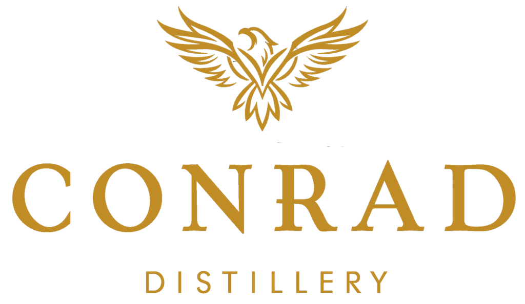Gold soaring hawk logo above “Conrad Distillery” in elegant serif font representing luxury, elevation, and craftsmanship.