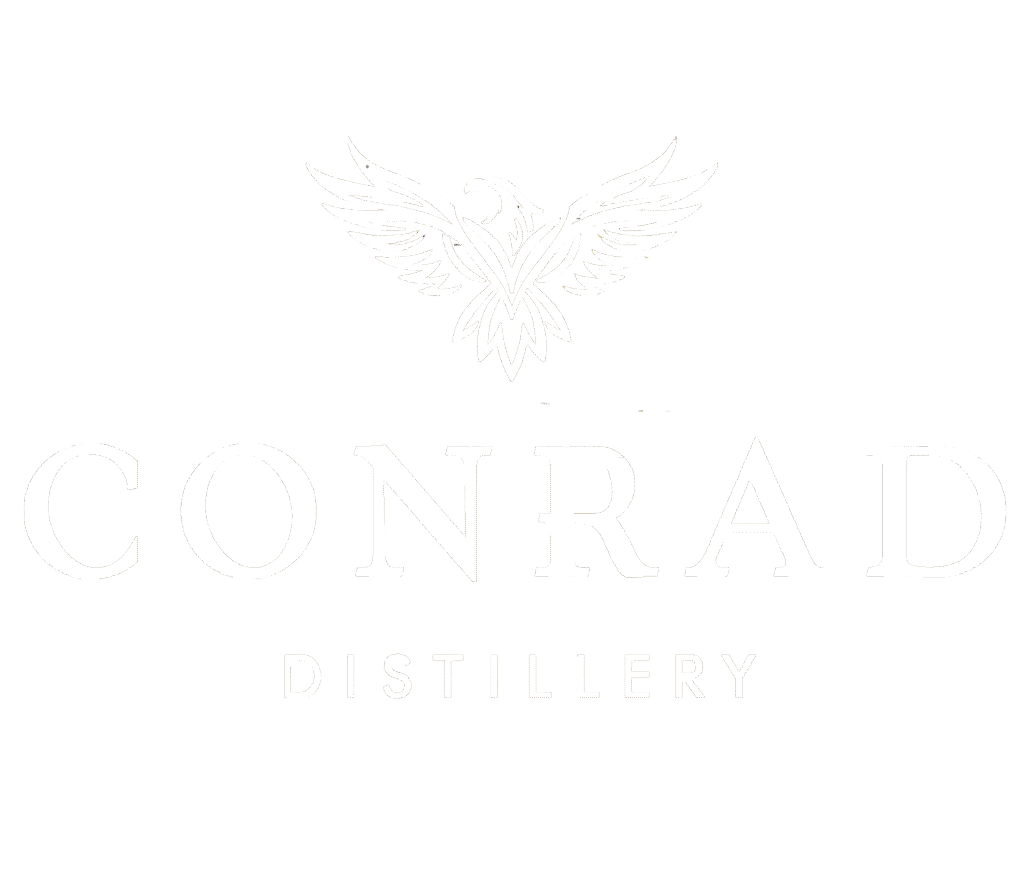 White soaring hawk logo above “Conrad Distillery” in elegant serif font representing luxury, elevation, and craftsmanship.