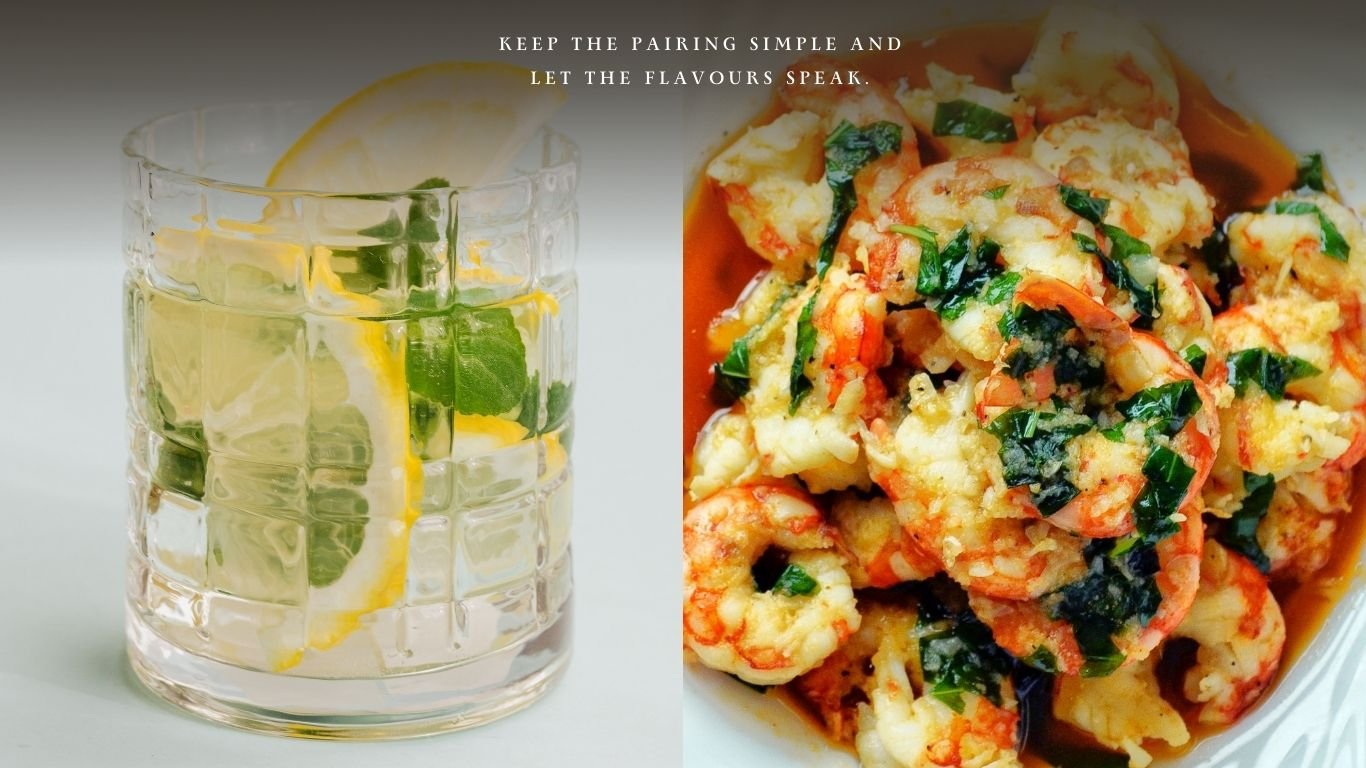 Conrad Gin and Tonic with lemon and mint served alongside grilled prawns with herbs and olive oil.