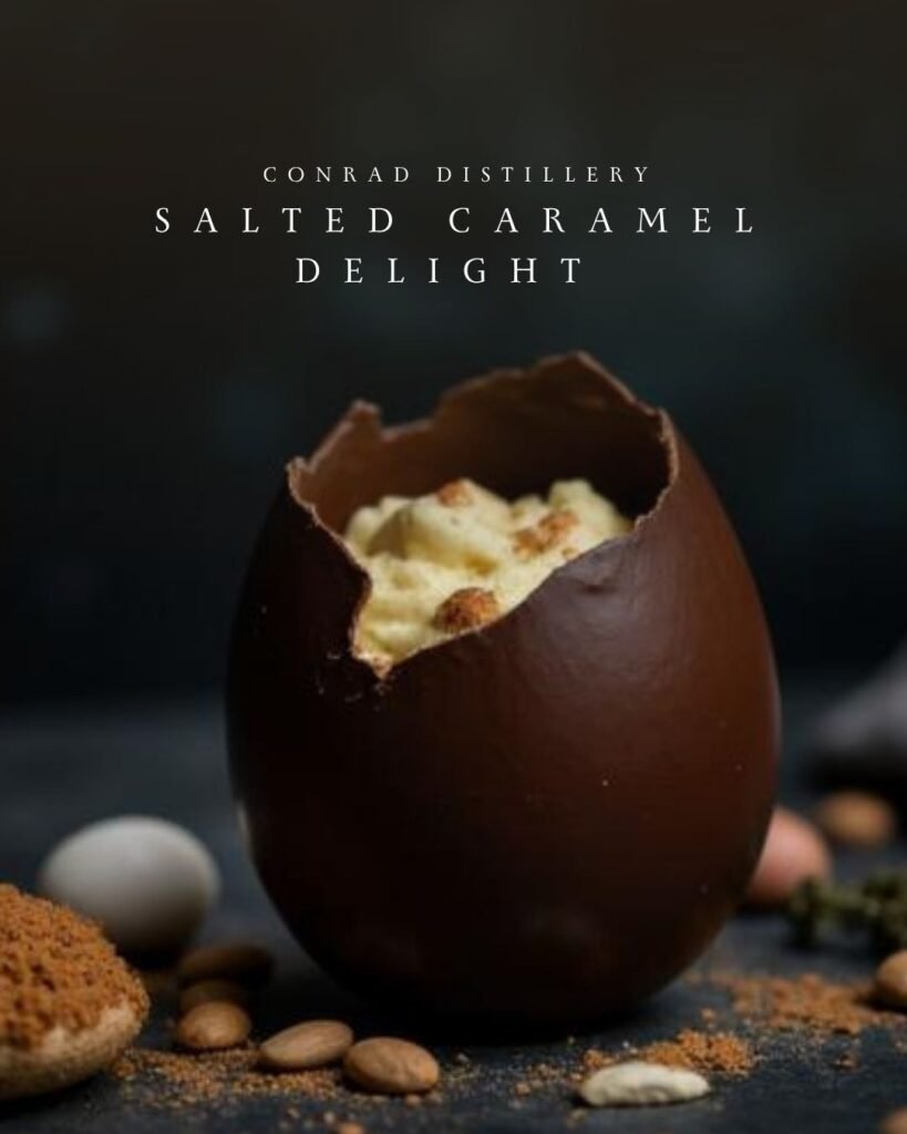 Salted Caramel Delight cocktail served in a chocolate Easter egg filled with creamy mousse and topped with honeycomb crumble.