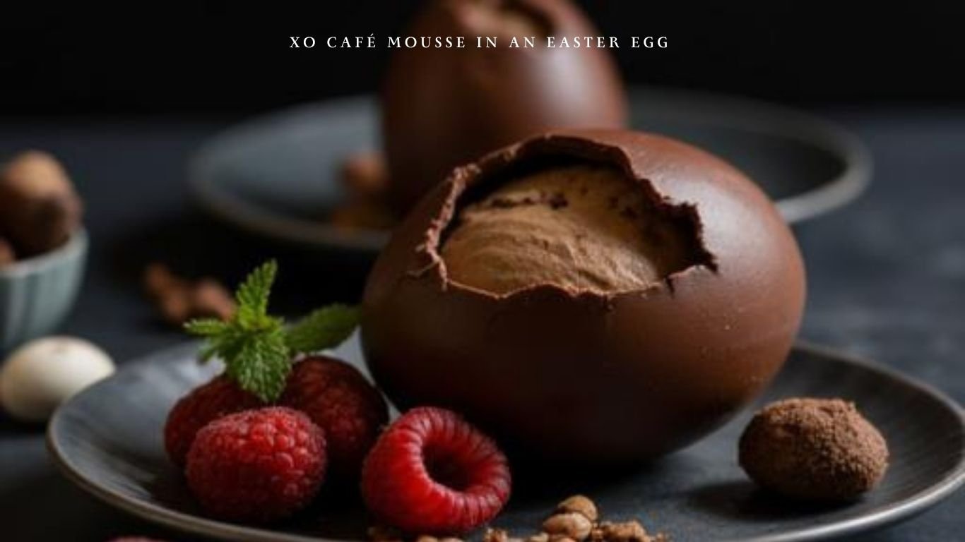 Chocolate Easter egg filled with XO Cafe coffee mousse served with raspberries and mint.